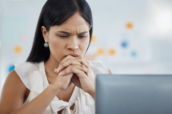 Woman looks stressed because of a phishing scam